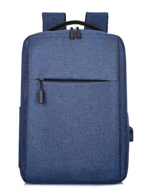 Dark blue canvas backpack with textured finish, front zipper pocket, and USB port.