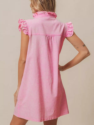 Pink denim dress with ruffled collar and cap sleeves.