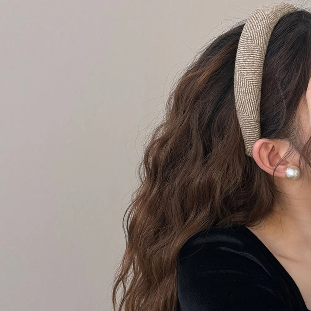 Textured tweed padded headband in Khaki with herringbone pattern.