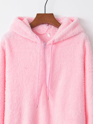 Pink fuzzy fleece half-zip hoodie with drawstring and hood.