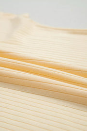 Ribbed cotton fabric in a pale yellow color, showing texture detail.