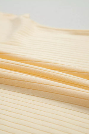 Ribbed cotton fabric in a pale yellow color, showing texture detail.