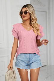 Blush pink eyelet knit v-neck blouse with flutter sleeves and diamond pattern detail.
