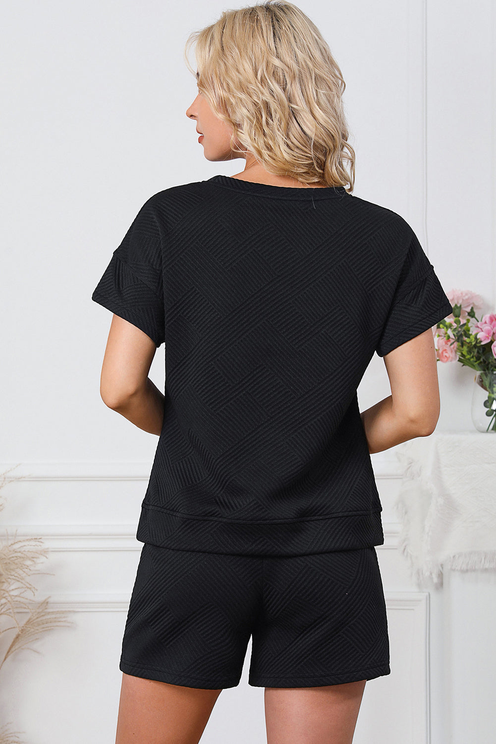 Black geometric quilted tee and short set with short sleeves and elastic waist shorts.