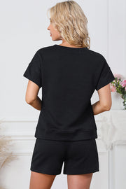 Black geometric quilted tee and short set with short sleeves and elastic waist shorts.