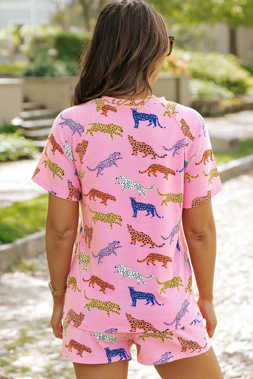 Pink leopard print loungewear set with short sleeves and shorts.