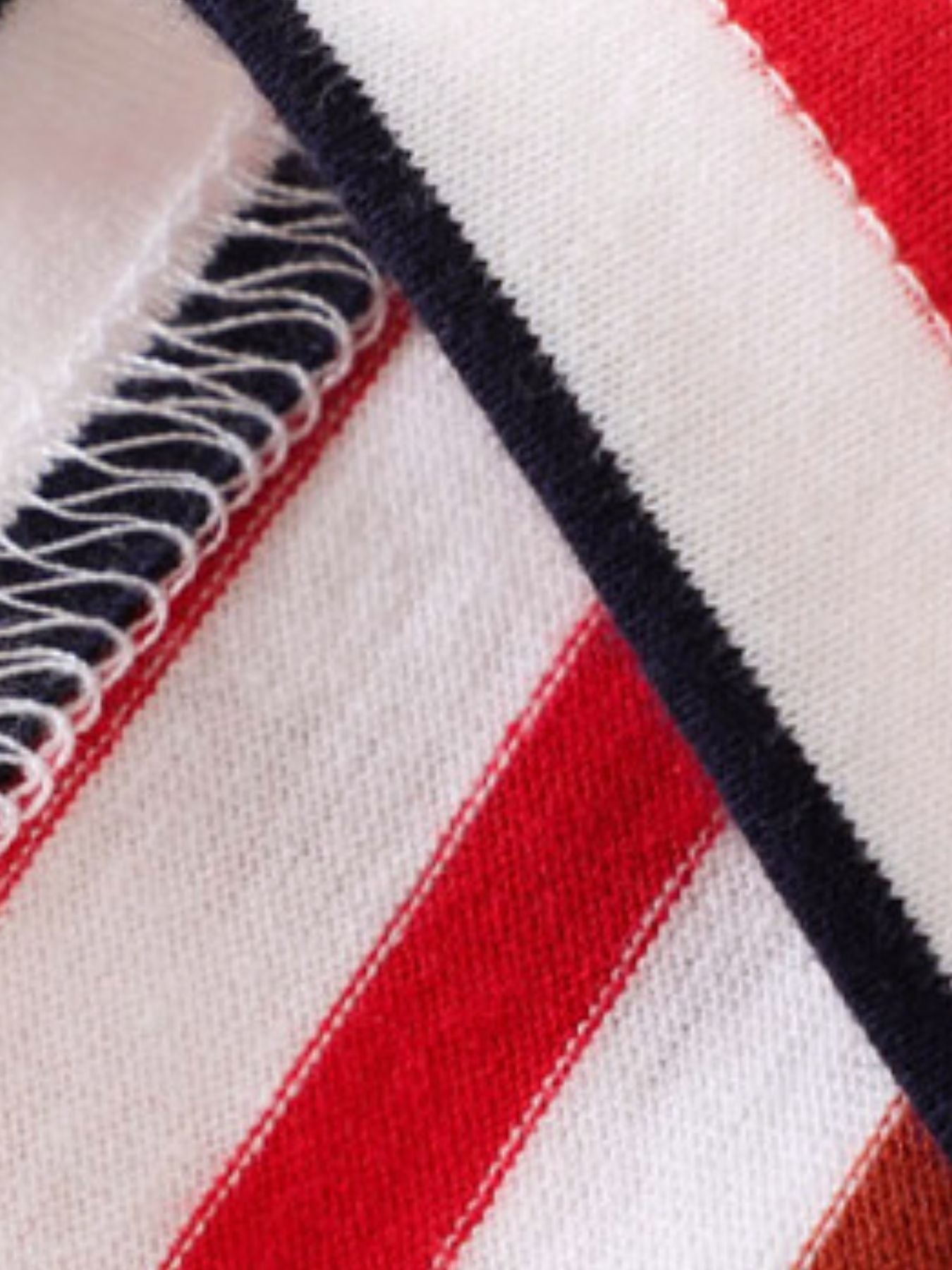 Toddler red, white, and blue striped cotton polo shirt and shorts set detail.
