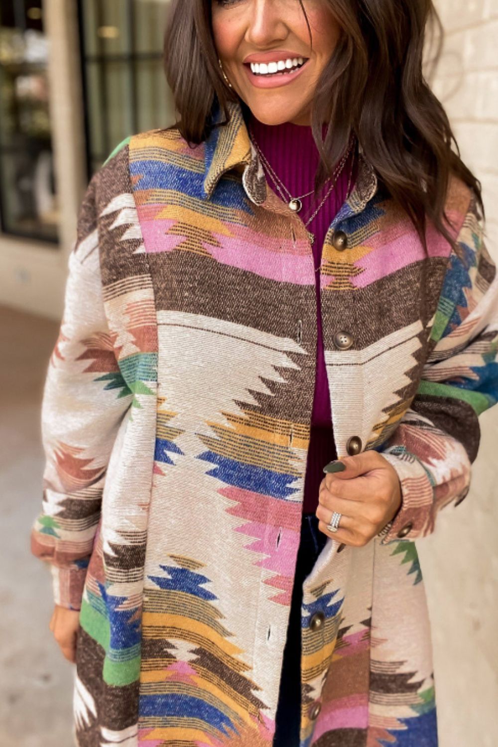 Southwestern print shirt jacket in beige with button front and collared neckline.