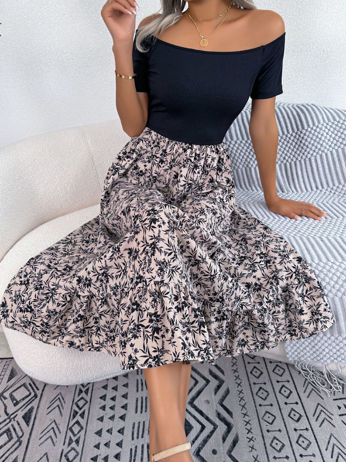 Black off-shoulder midi dress with a floral print A-line skirt