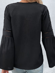 Black lace trim bell sleeve blouse with textured fabric and sheer details.