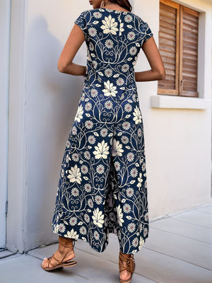 Botanical print culotte jumpsuit in navy with short sleeves and wide legs.