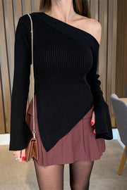Black asymmetric ribbed knit sweater with flared sleeves and off-the-shoulder neckline.