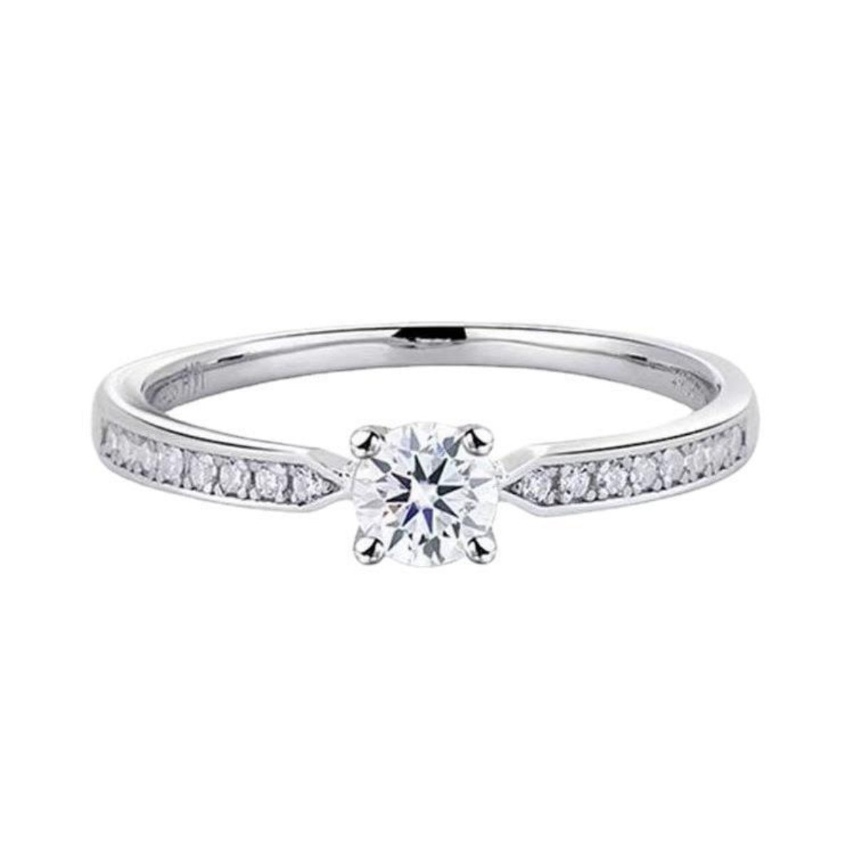 Sterling silver ring with a round moissanite center stone and channel-set accent stones.