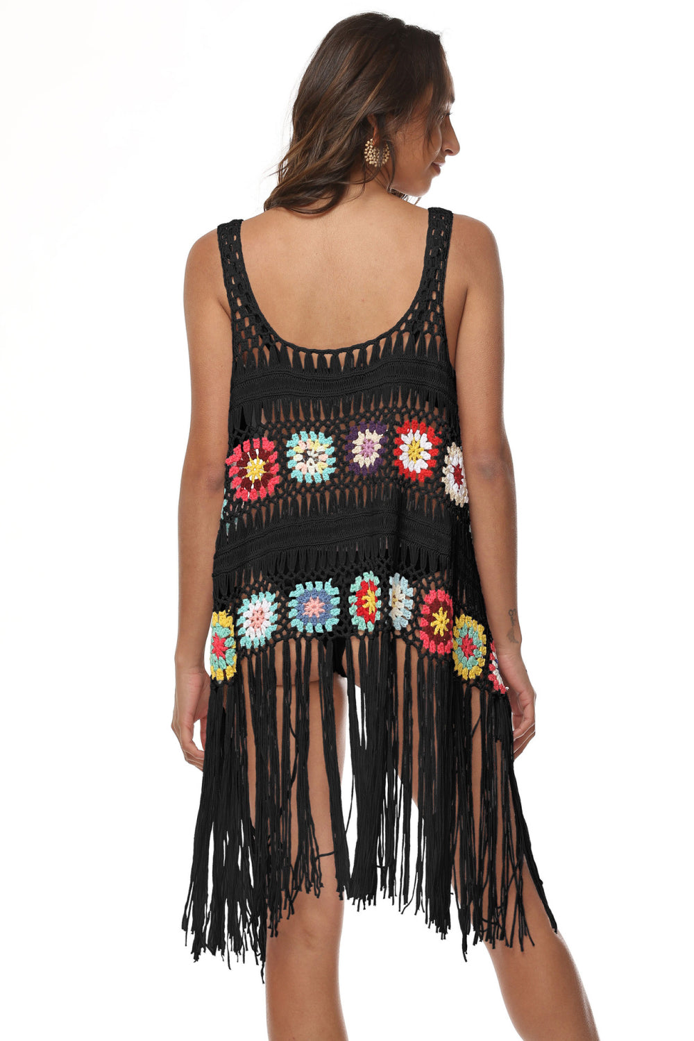 Black crochet vest with colorful floral squares and fringe detail, scoop neck, sleeveless.