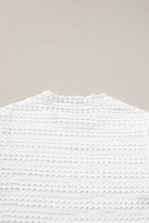 White textured long sleeve blouse with ruffle trim neckline