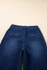 Mid-rise straight leg jeans in dark wash denim with two back pockets and belt loops.