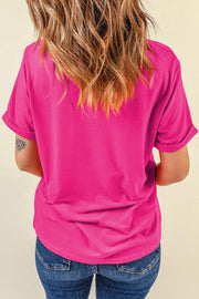 Hot pink t-shirt with rolled sleeves and a casual fit.