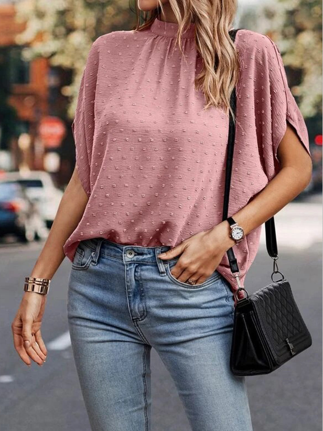 Textured dot back-tie blouse in Dusty Pink with short sleeves and a mock neck.