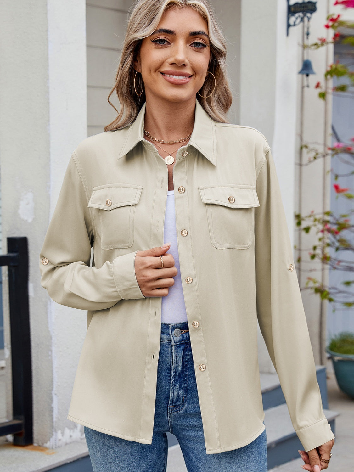Beige utility crepe shirt with button-flap chest pockets and roll-tab sleeves.