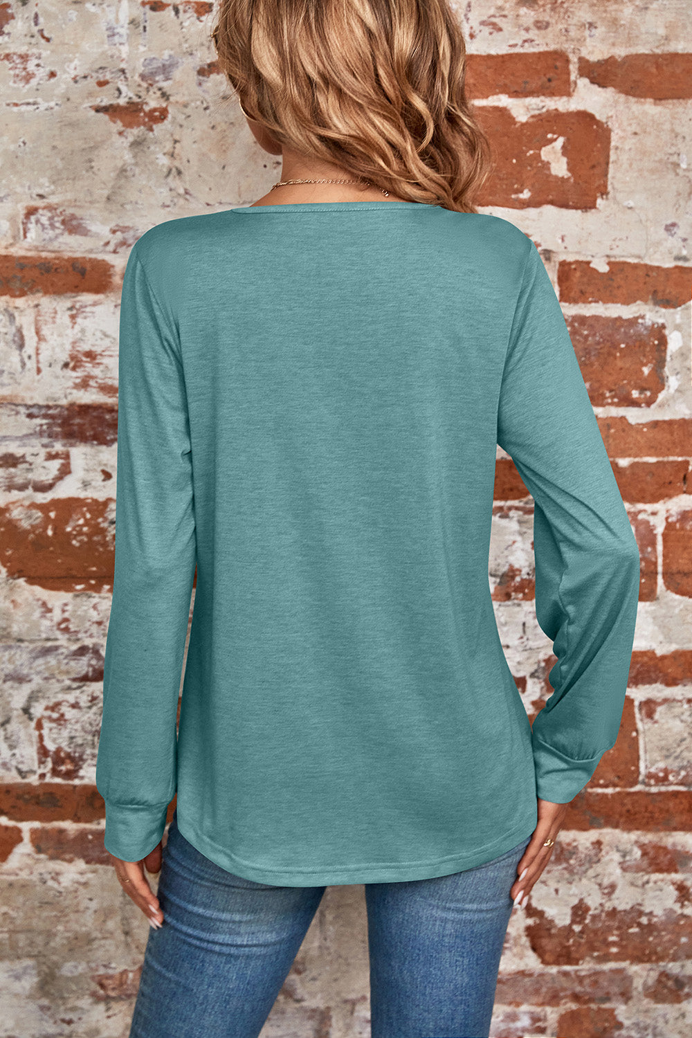 Light green long sleeve top with square neckline and subtle pleats, casual chic style.