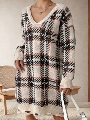 Plaid knit tunic with distressed hemline and V-neck.