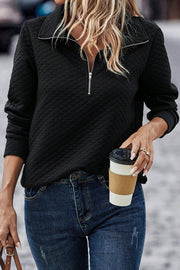 Black diamond quilted zip-neck pullover sweatshirt with a collared neckline.