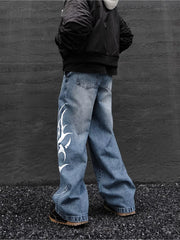 Men's blue denim wide leg jeans with tribal print detail