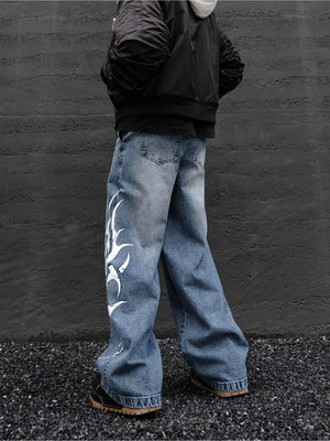 Men's blue denim wide leg jeans with tribal print detail