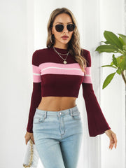 Flared sleeve crop knit sweater in wine with pink and white stripes.
