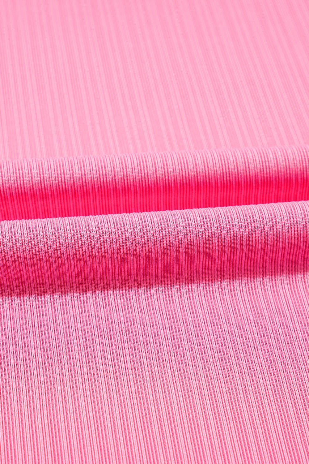 Pink ribbed knit skirt detail with a drawstring waist