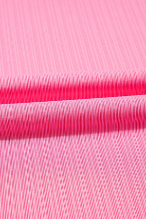 Pink ribbed knit skirt detail with a drawstring waist