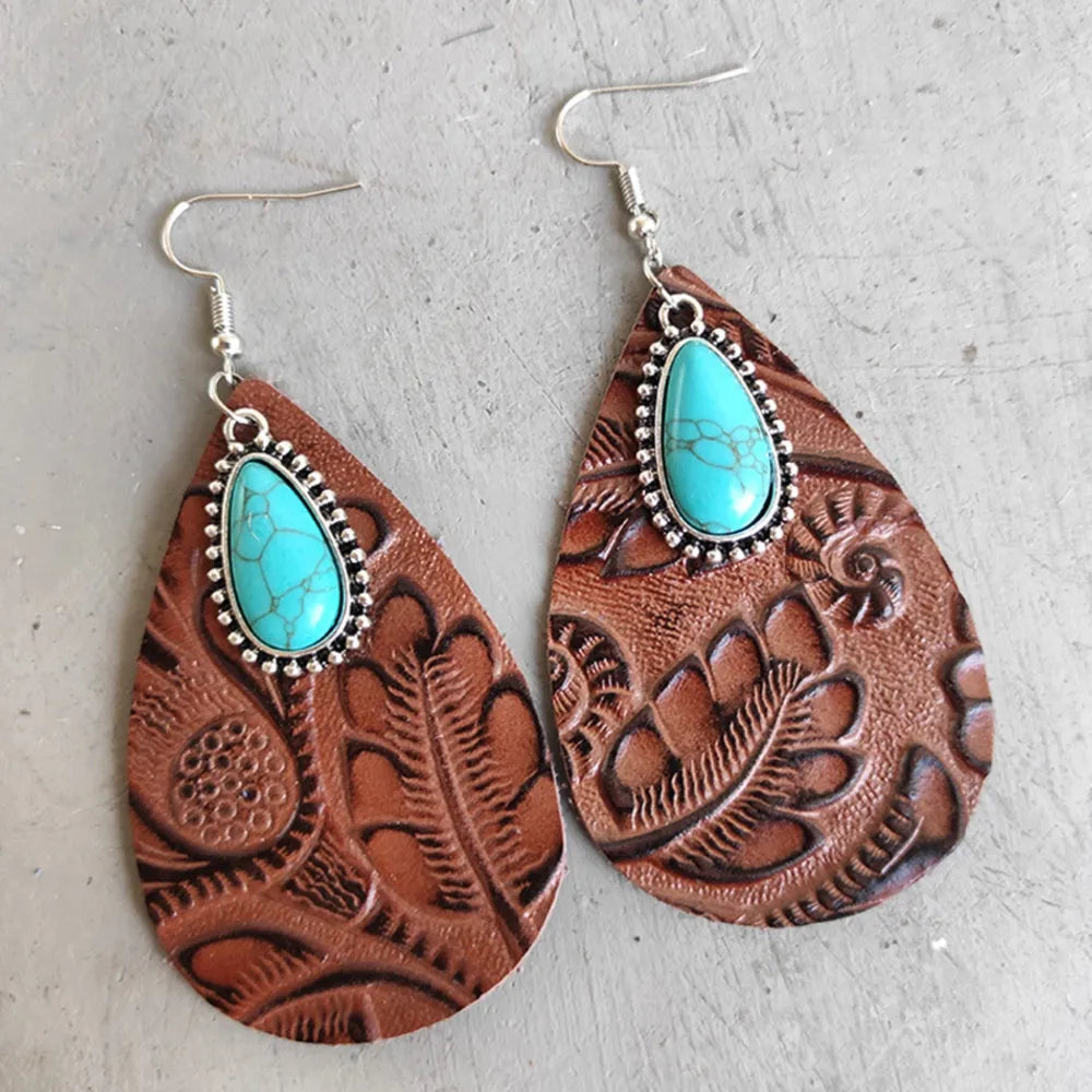 Brown tooled leather teardrop earrings with turquoise stones and silver trim