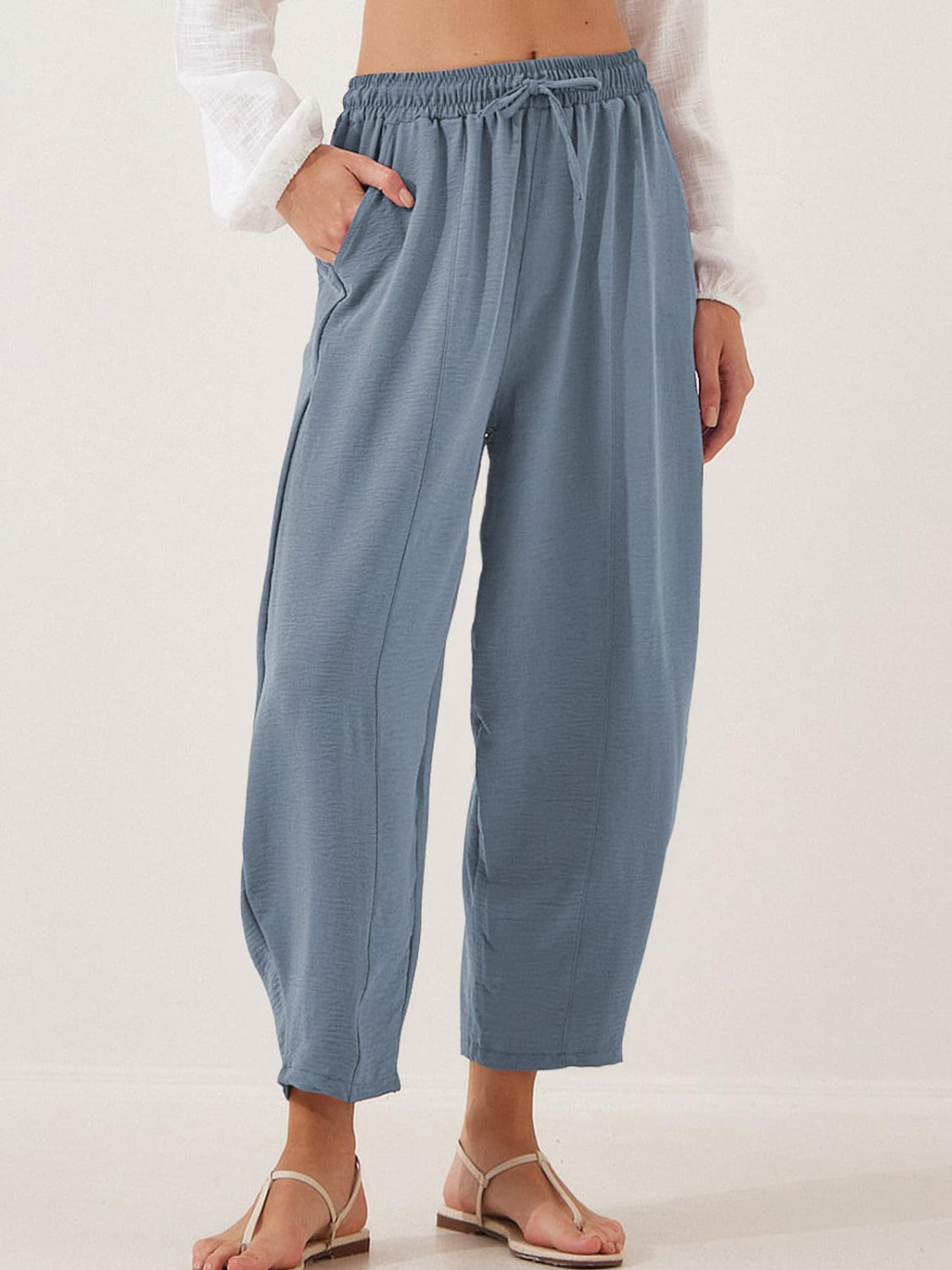 Air Force Blue balloon-leg drawstring trousers with seam detail and pockets.