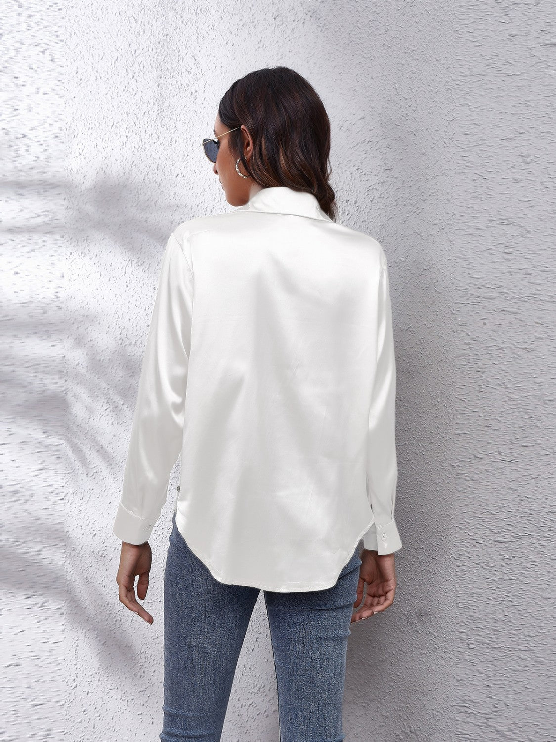 White satin collared button-down shirt with long sleeves, shown from the back.