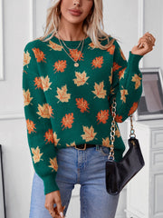 Green knit jumper with autumnal leaf motif, crew neck, long sleeves, and balloon sleeves.