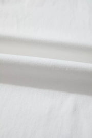 White denim casual wide-leg jeans showing fabric texture