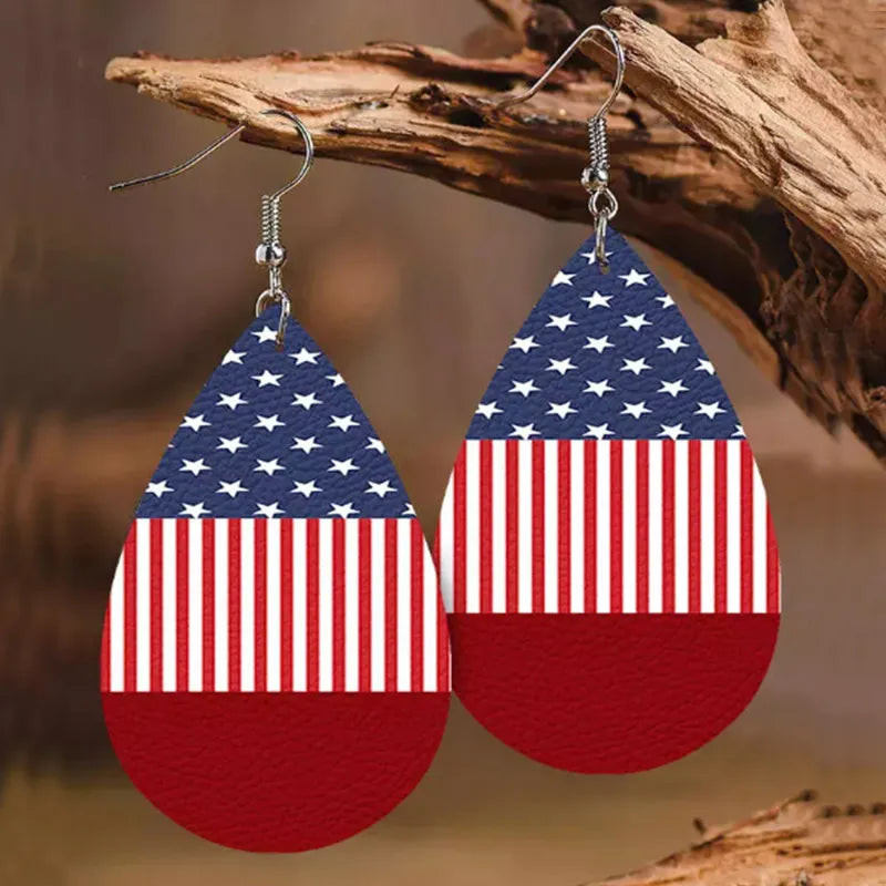 Patriotic faux leather teardrop earrings with American flag design in red, white, and blue.