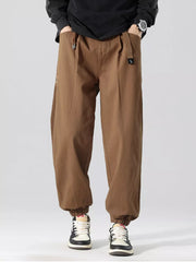 Oversized coffee cargo joggers with drawstring waist and elastic cuffs.