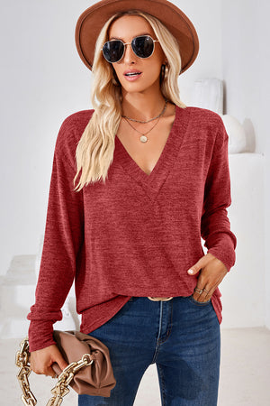 Relaxed V-neck tunic top in Rust with long sleeves and a heathered texture.