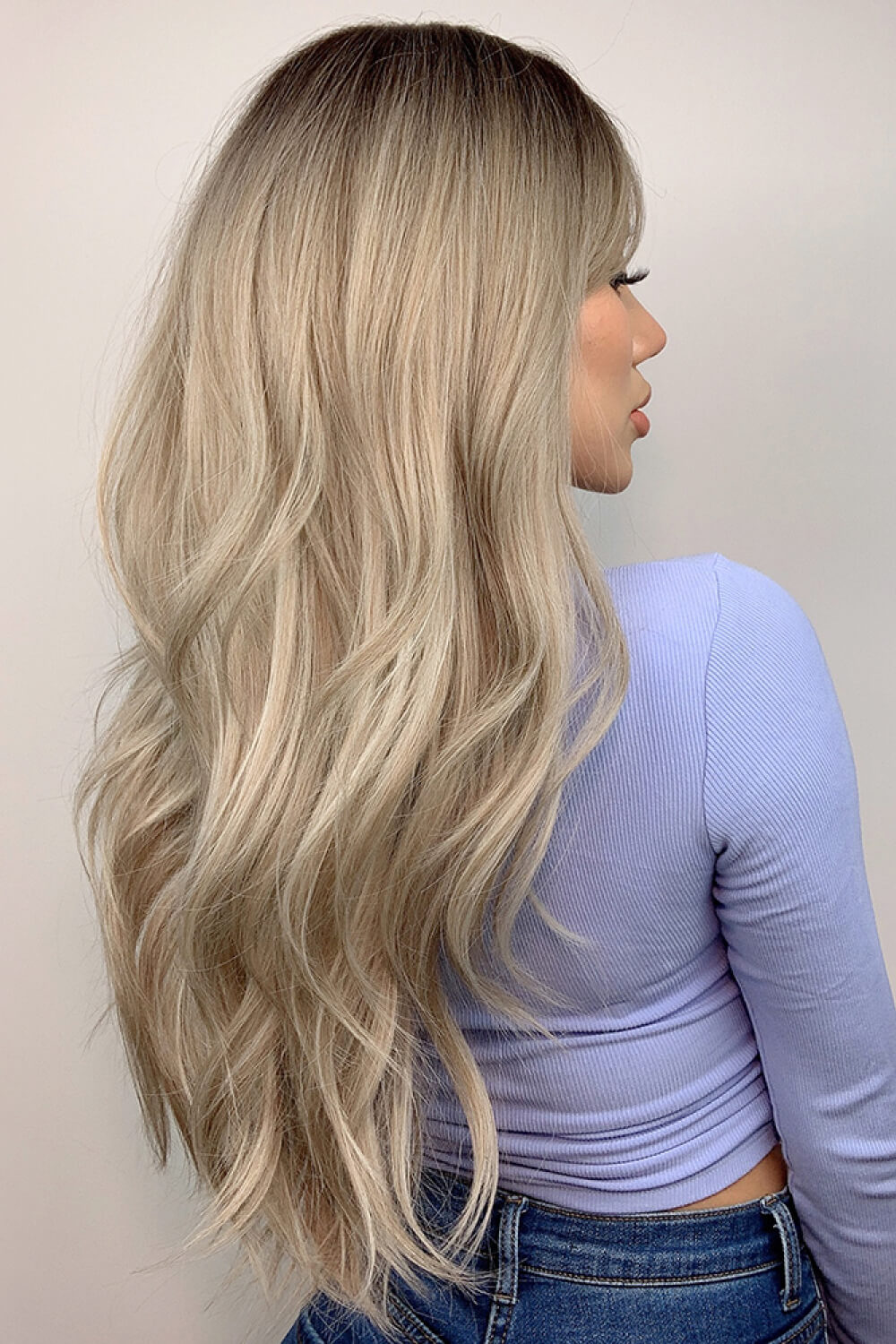 Ombre Wave Frontal Wig in Ash Blonde Balayage with loose waves and dark roots.