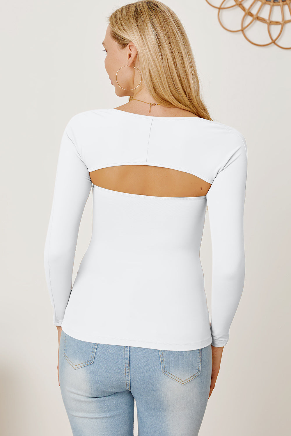 White long sleeve bodysuit with open back detail