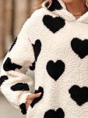 Cream sherpa hoodie with black heart print and hood.