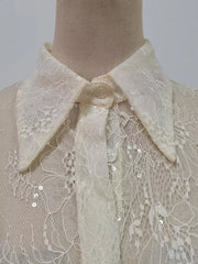Apricot lace dress with floral pattern, sequins, and ruffled hem detail.