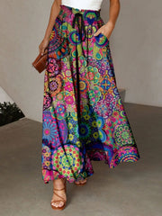 Maxi skirt with multicolor feathered print, adjustable waist, and pockets.