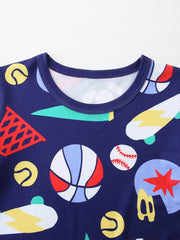 Navy blue kids' tee with a sporty print of basketballs, skateboards, and tennis balls.