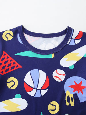 Navy blue kids' tee with a sporty print of basketballs, skateboards, and tennis balls.