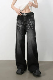Dark wash wide leg jeans with sculpted detailing and a faded effect.
