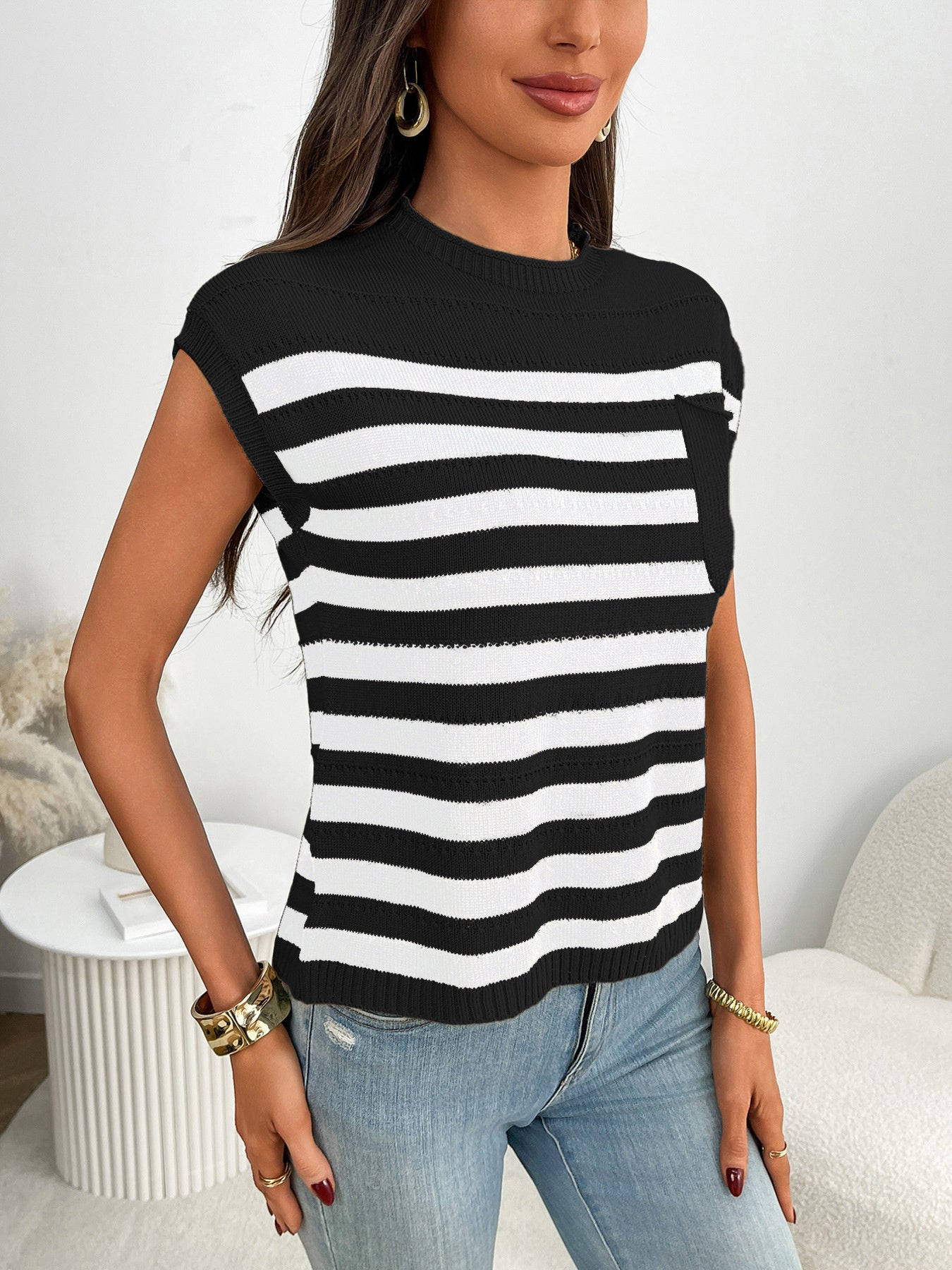 Black and white striped knit sweater with a chest pocket and cap sleeves.
