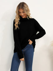 Black textured knit oversized turtleneck pullover sweater with a relaxed fit.