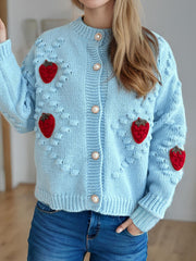 Pastel blue knit cardigan with strawberry patches and pearl buttons